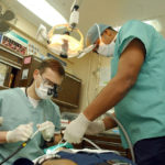 dentist doing dental surgery
