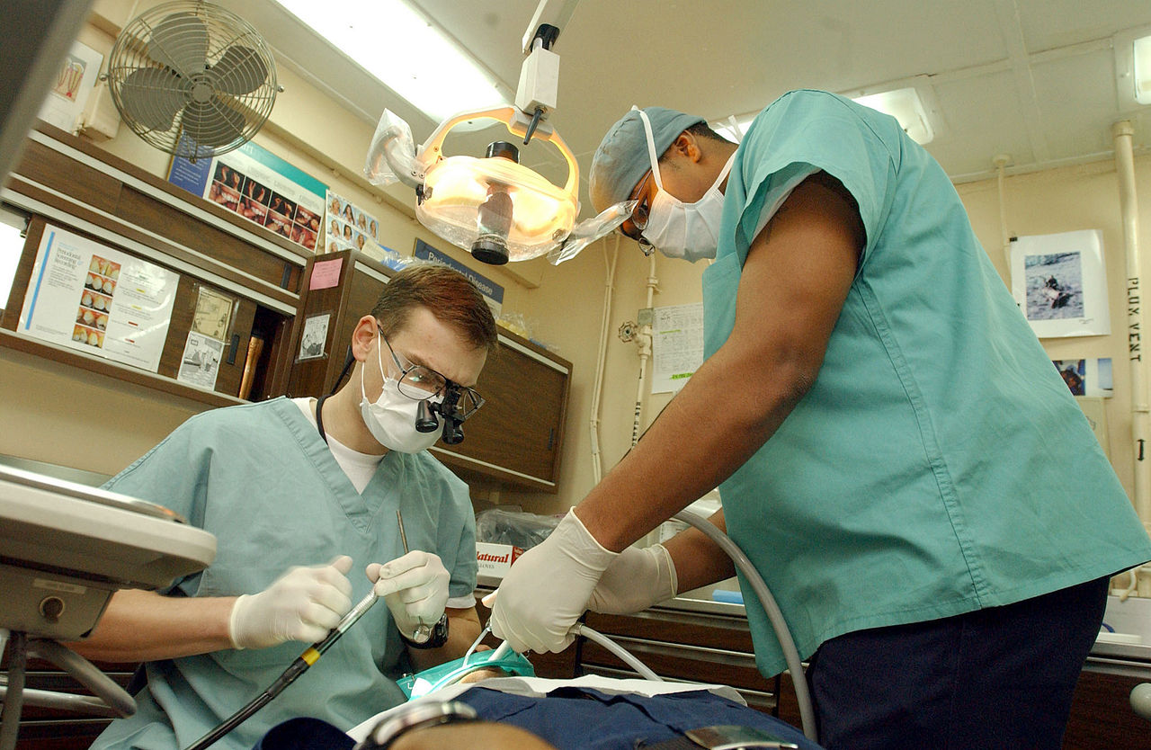 dentist doing dental surgery